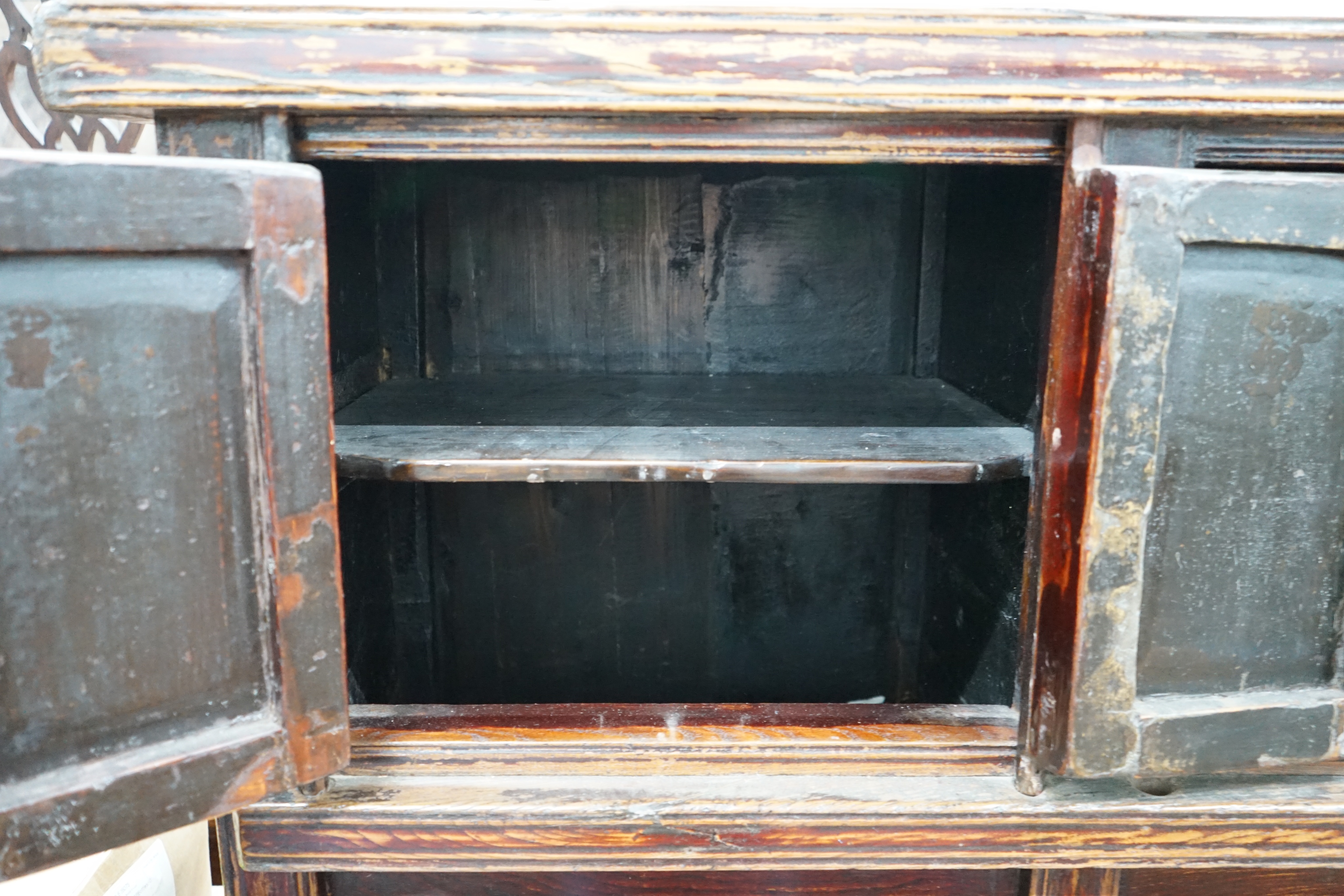 A Chinese caned pine low cabinet, width 116cm depth 48cm height 76cm